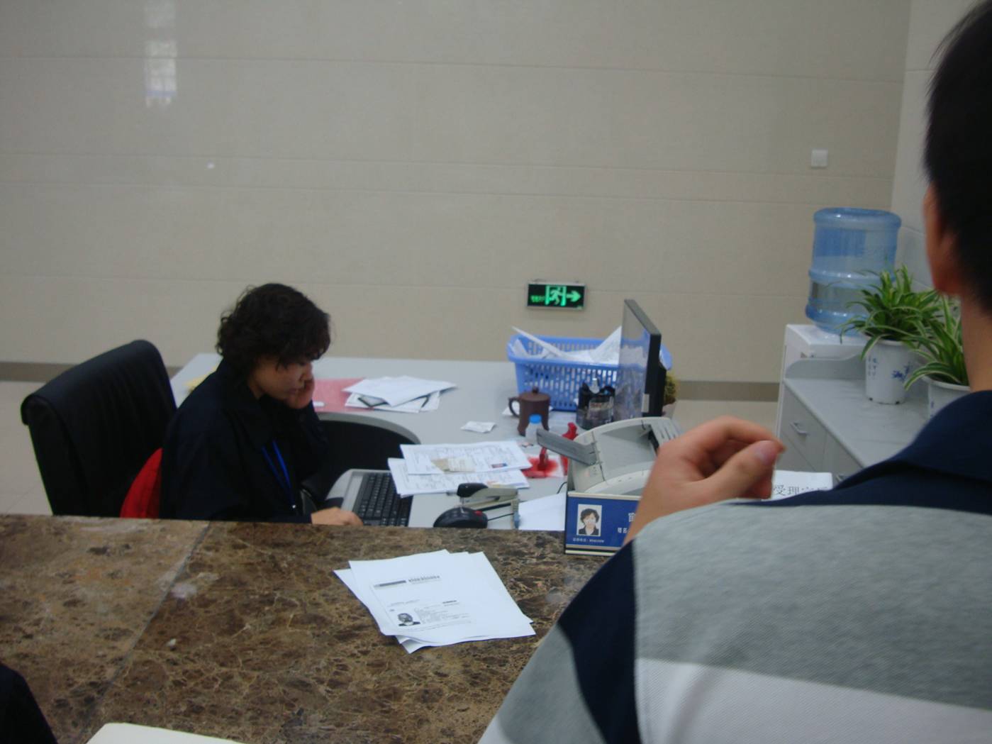 Getting a Chinese driver's license, the paperwork lady.  Wuxi, China