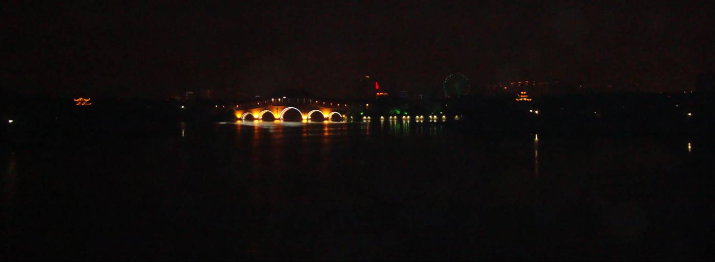 Picture:  The footbridge near Jiangnan University, across a part of Tai Hu,  lit like a dragon.  Wuxi, China