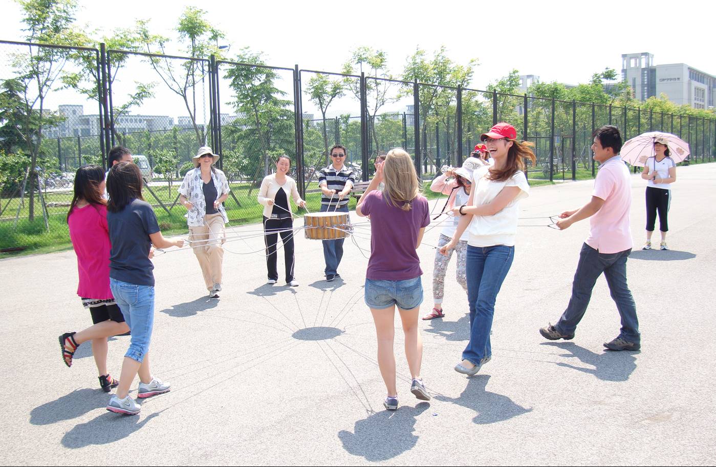 Picture:  A lively game of drum ball. Ruth's team won with seventeen bounces.  Sports activity day at North American College of Jiangnan University.  Wuxi, China
