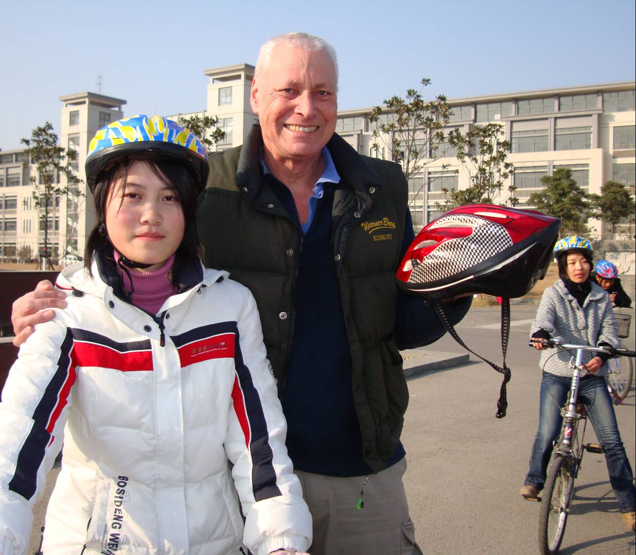 Click to see the article in the Yangze Evening Post. David Scott and student with bicycle helmet,  Jiangnan University,  Wuxi,  China