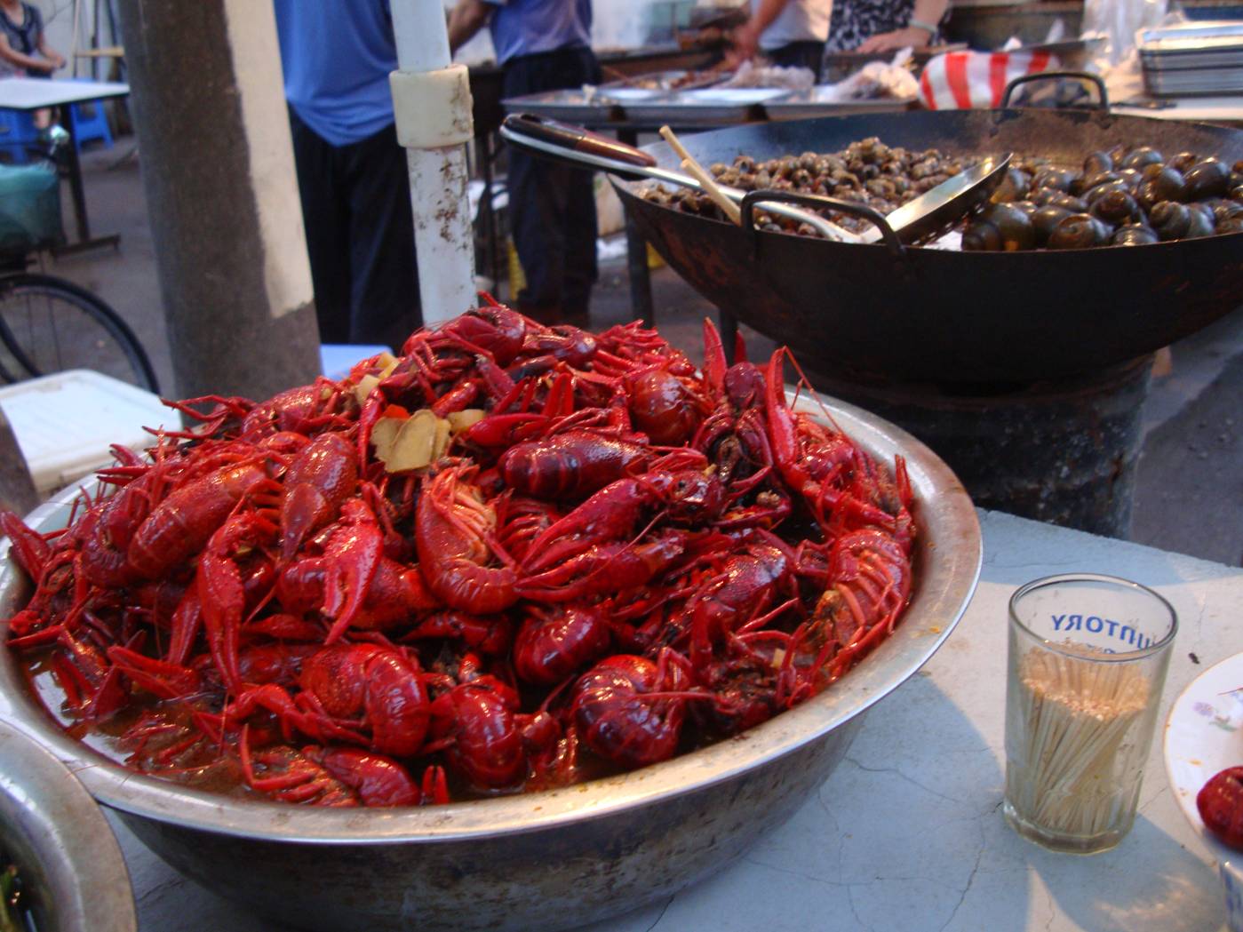 Picture:  I find the crawfish too picky to be worth the trouble, but thousands disagree.  Street food in Shi Tang Cun, Wuxi, China