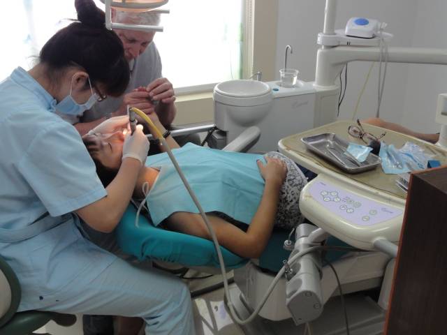 Picture:  I held Panda's hand while she had her teeth cleaned.  The least I could do. Wuxi, China.
