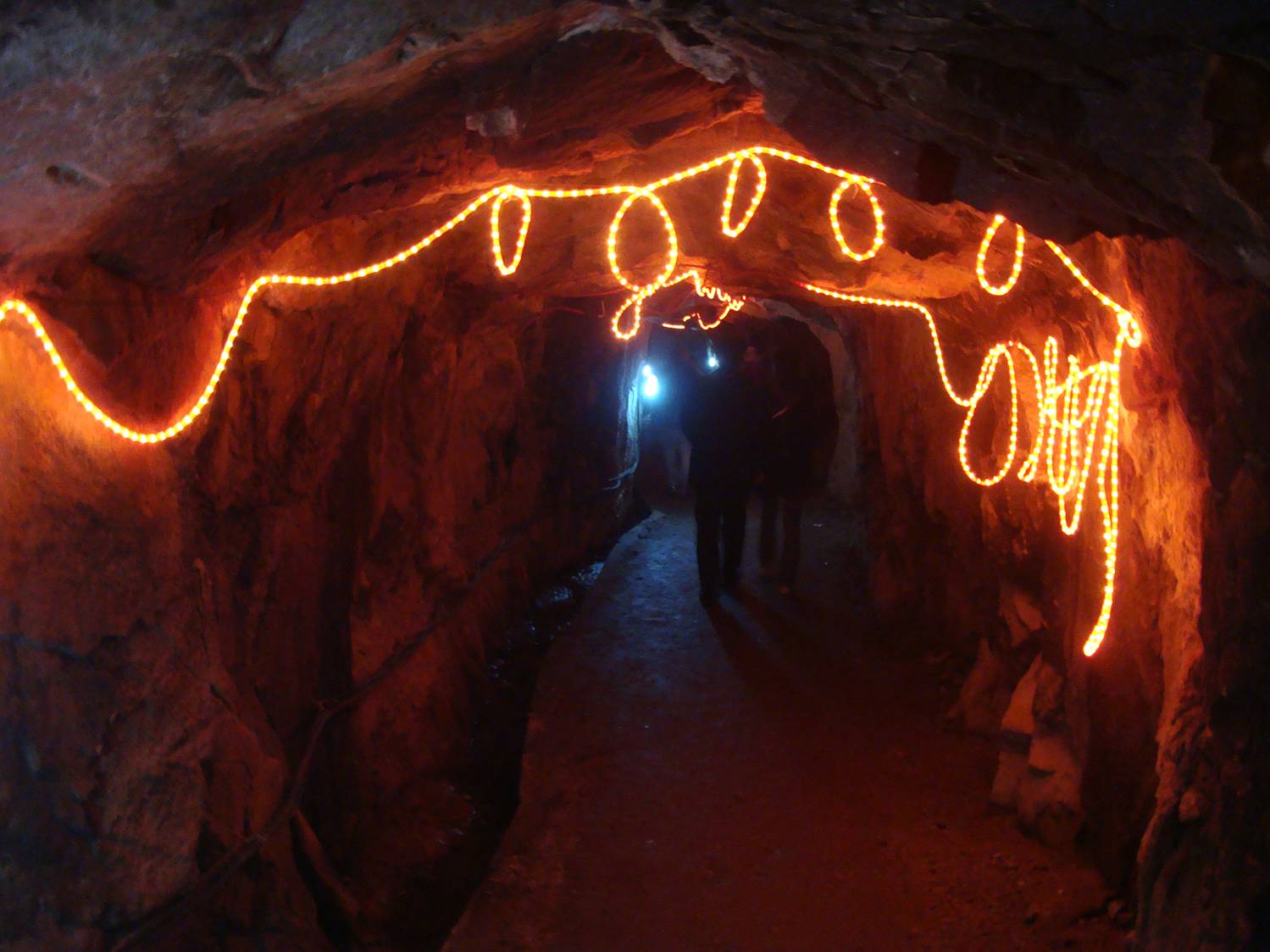 Picture:  The tunnel through Daming Shan, lit by rope lights.  Daming Shan, Zhejiang, China
