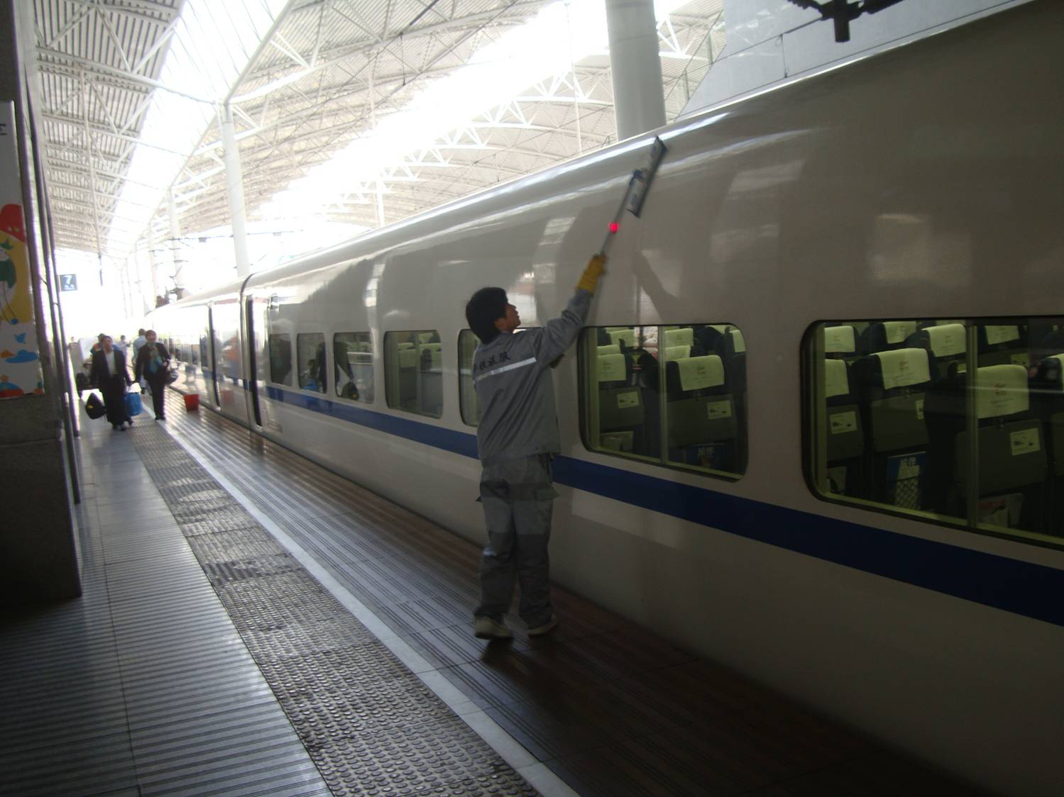 Picture: The new G train has a team of cleaners working on it when it gets to Shanghai.
