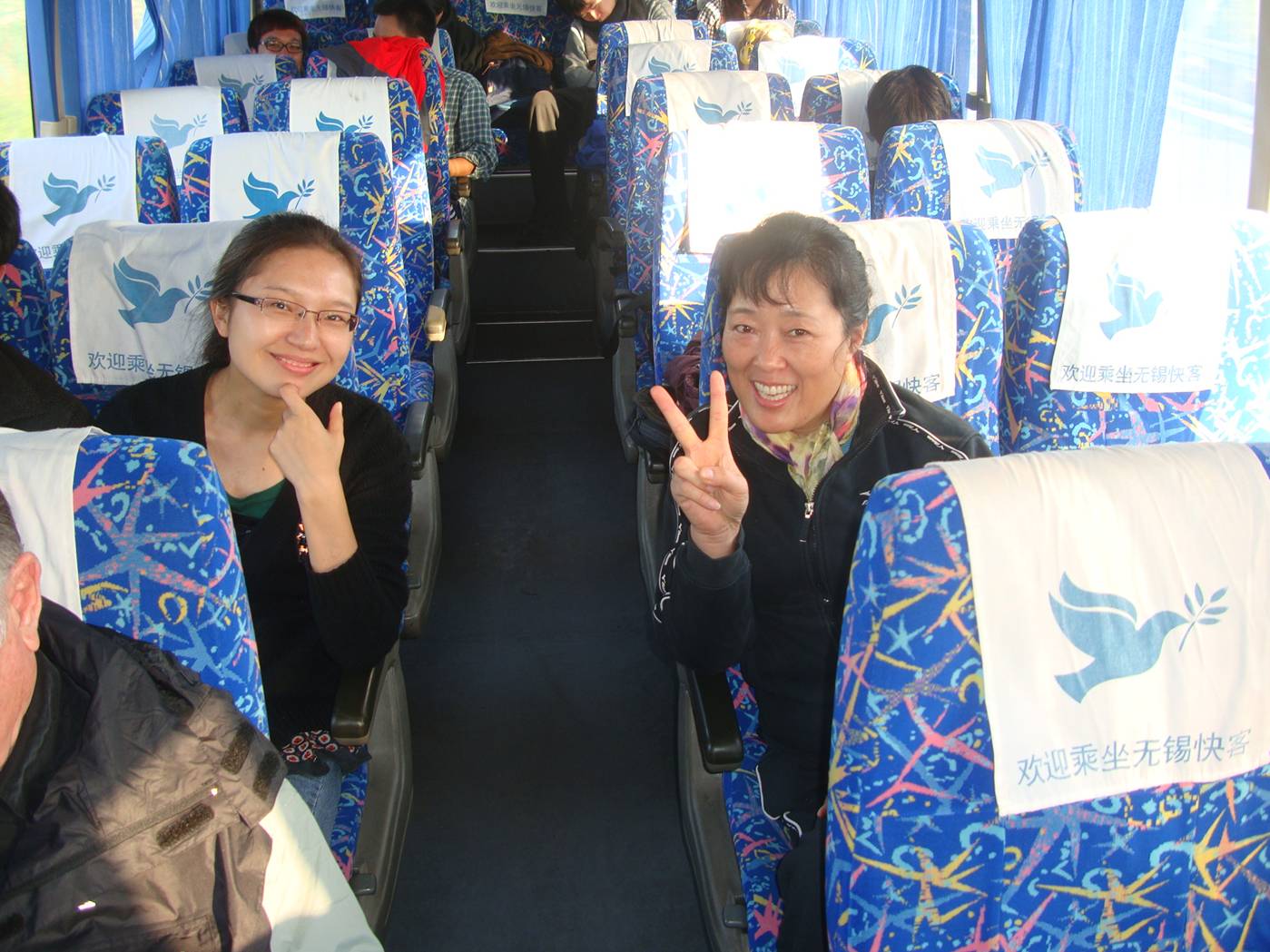 Picture:  Jesse and Ms. Liu on the bus to Daming Shan, Zhejiang Province, China