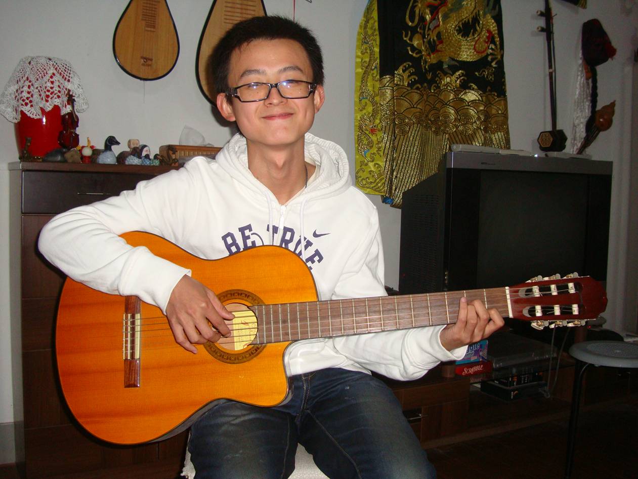 Picture:  Jimmy, my new guitar student.  He's got tha C to Am change down already.  Jiangnan University, Wuxi, China