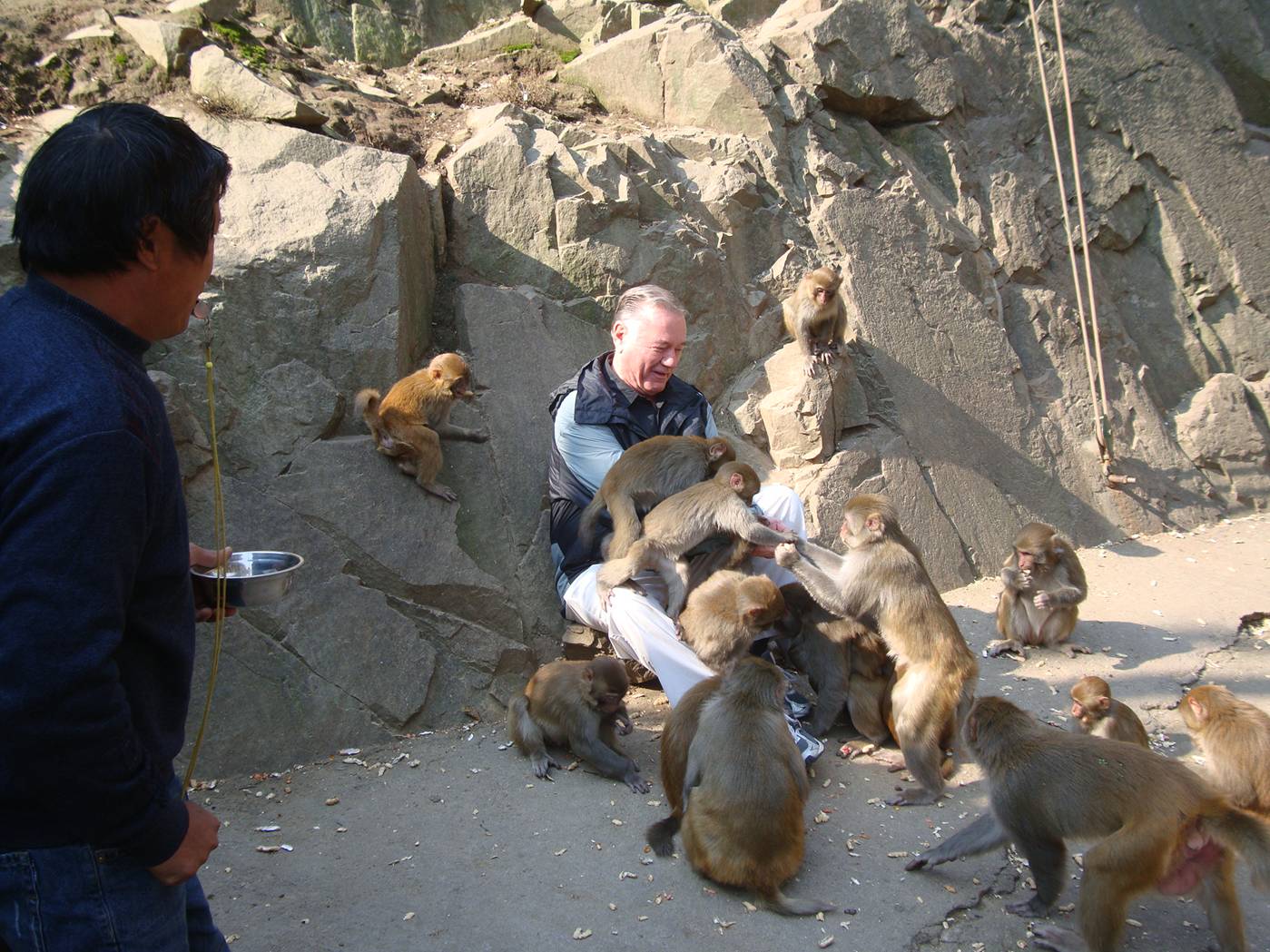 Picture: Fellow teacher, Professor Don Bird paid ten yuan to be mobbed by monkey along the path to the headwaters of Lake Tai, Zhejiang Province, China