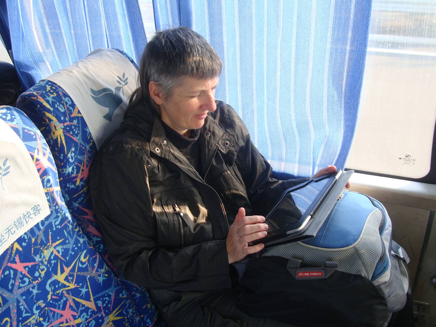 Picture:  Ruth iPads on the bus to Daming Shan, Zhejiang Province, China