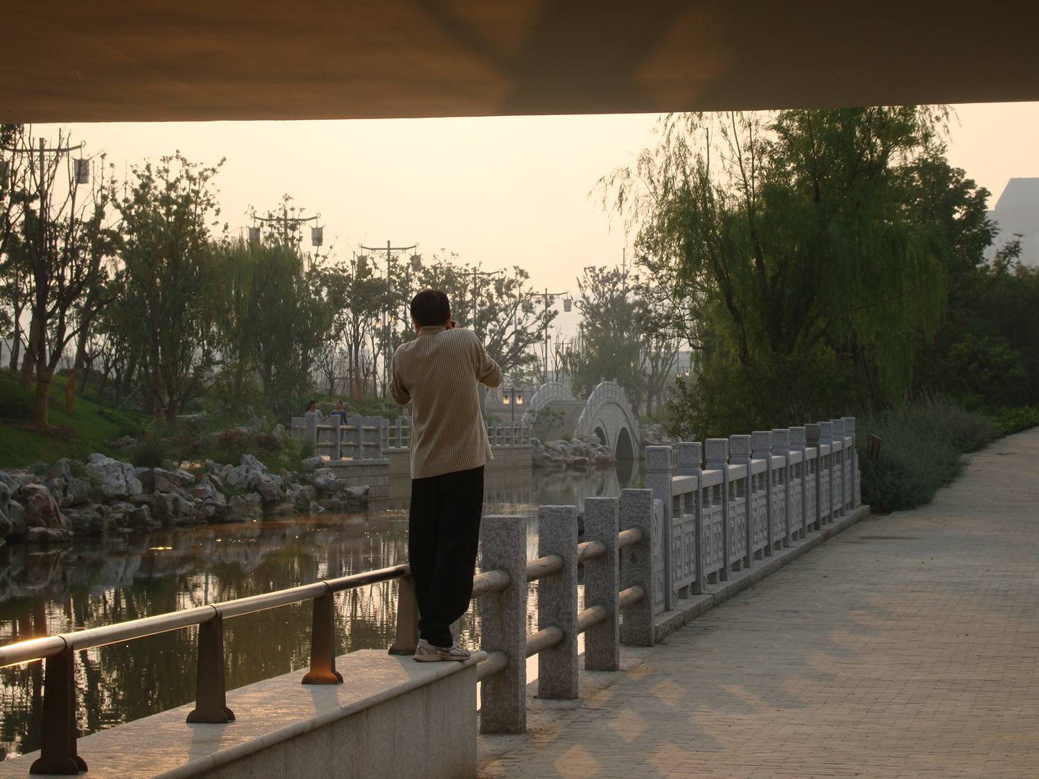 picture: We weren't the only photographers in the park, though nearly the only visitors that day.  Canal side park near Jiangnan University, Wuxi, China