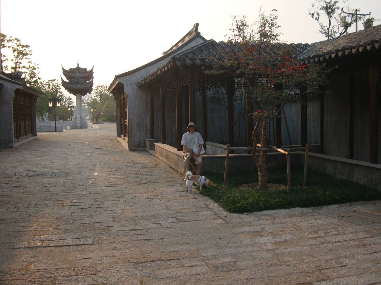 picture: Ruth and GouGou take a break in the brand new ancient village.  Canal side park near Jiangnan University, Wuxi, China