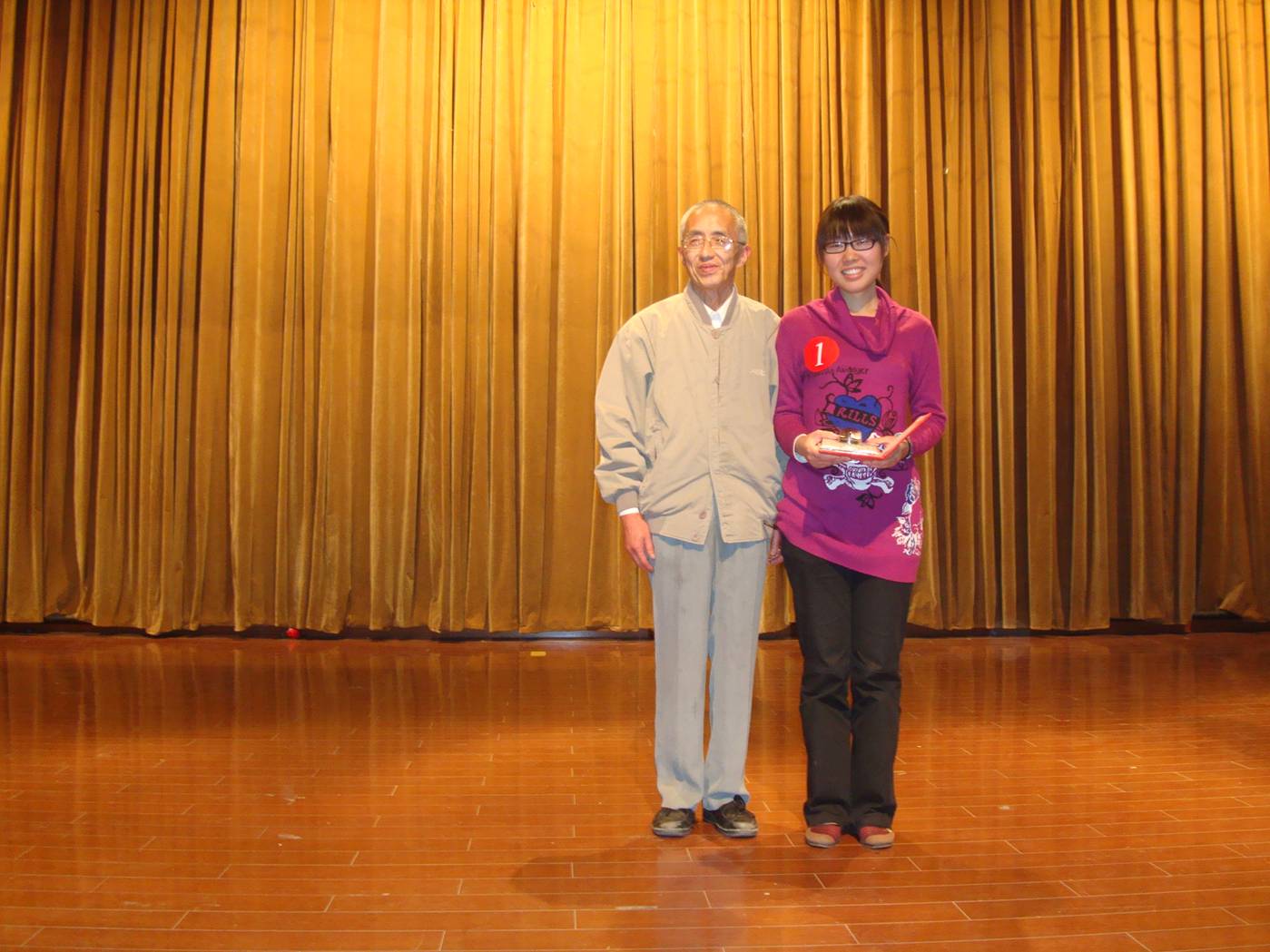 Picture:  Lily, the winner of this year's English Speech Contest at Jiangnan University.