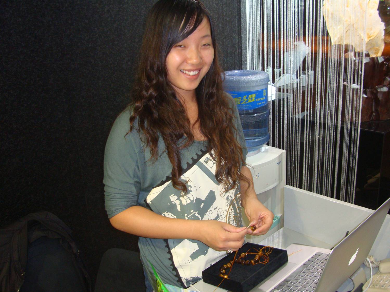 picture:  Simona sizes a tiger eye bracelet to fit my wrist.  Ruth and I each got one as a wedding present