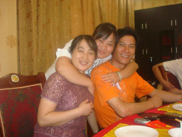 Julia with her mother and father,  Wuxi,  China