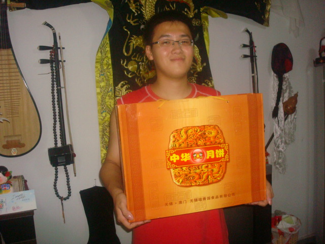 George with the gift of moon cakes.