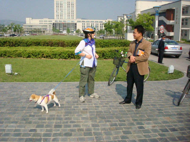 Ruth, GouGou,  and Michael Bian,  Deputy Director of the International Office,  waiting for the police and vet at the East Gate of Jiangnan University,  Wuxi,  China